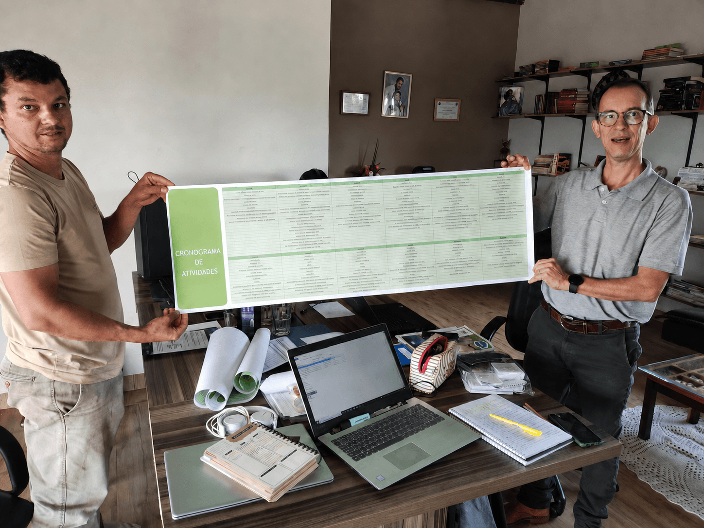 Professionals presenting an operational activity schedule for a cattle farm