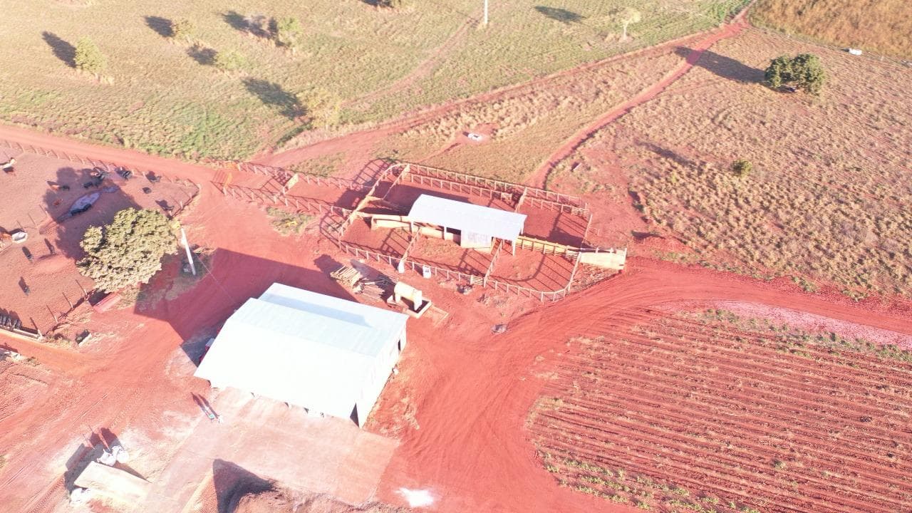 Aerial view of the ranch headquarters showing operational buildings, cattle-handling corrals and internal roads across the property.