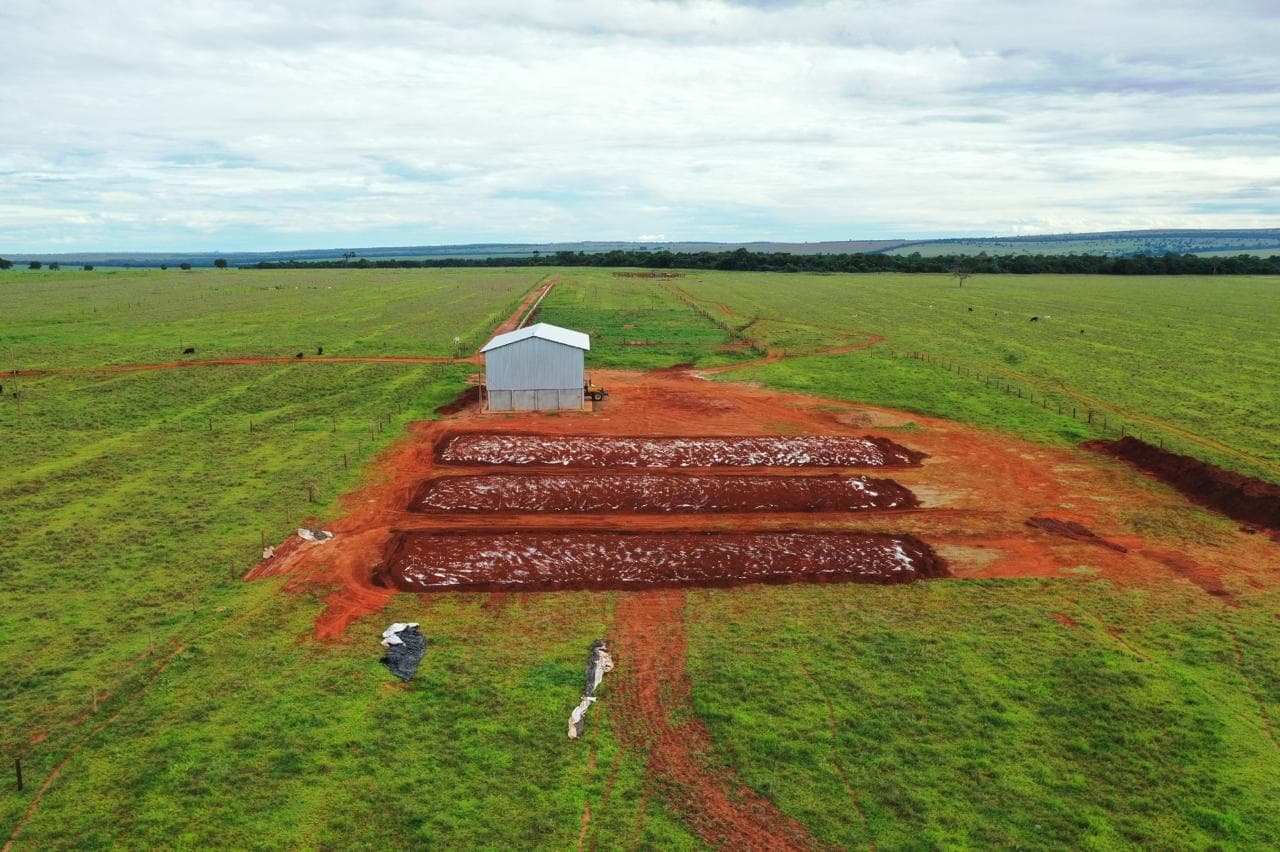 Closer aerial view of the completed silage bunkers and adjacent feed storage building.